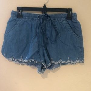 Red camel shorts in a size medium.